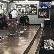 Barber chairs and stations at FreshCuts Barbershop