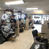 The barber crew working with clients at FreshCuts